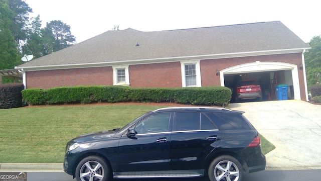 4955 Highland Lakes Dr, South Fulton, GA 30349 - view of side of home featuring a garage, brick siding, a yard, roof with shingles, and concrete driveway