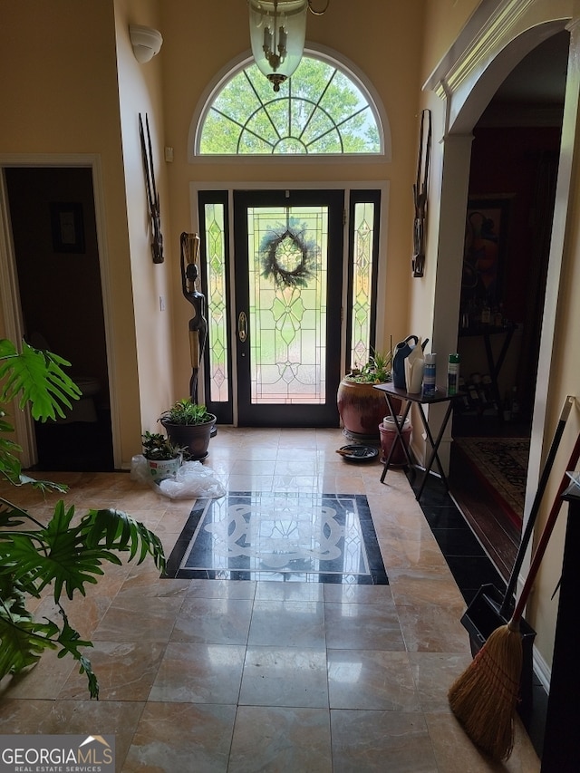 4955 Highland Lakes Dr, South Fulton, GA 30349 - entryway featuring a towering ceiling and arched walkways