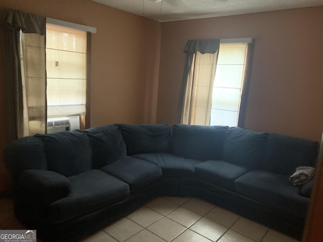 living room with light tile patterned floors and cooling unit