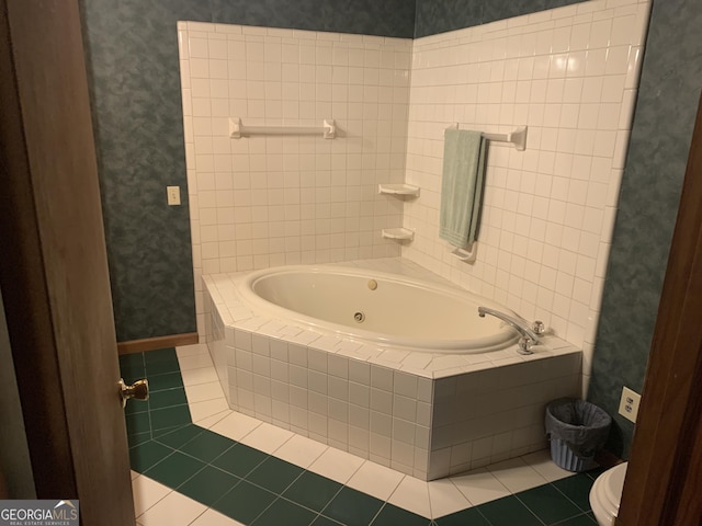 bathroom with tile patterned floors, toilet, a whirlpool tub, and wallpapered walls
