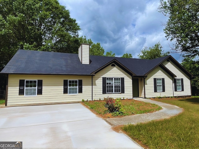 21 Manning Mill Way, Adairsville, GA 30103 - view of front facade with a chimney and concrete driveway