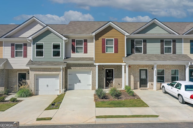 8714 Lakeview Commons Lot 48, Jonesboro, GA 30238 - multi unit property featuring concrete driveway, brick siding, and a garage