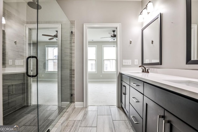 247 Franklin Rd, Atlanta, GA 30342 - bathroom with a sink, a stall shower, a ceiling fan, and double vanity