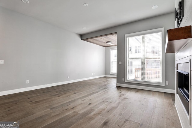247 Franklin Rd, Atlanta, GA 30342 - unfurnished living room featuring baseboards and wood finished floors
