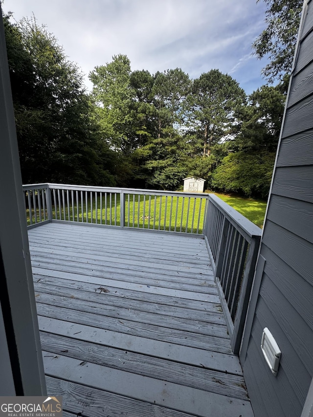 2204 Liberty Ln SW, Conyers, GA 30094 - wooden deck featuring a storage shed