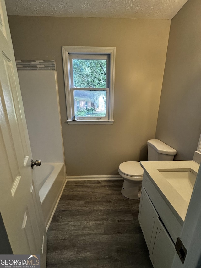 2204 Liberty Ln SW, Conyers, GA 30094 - bathroom featuring vanity, wood finished floors, and a textured ceiling