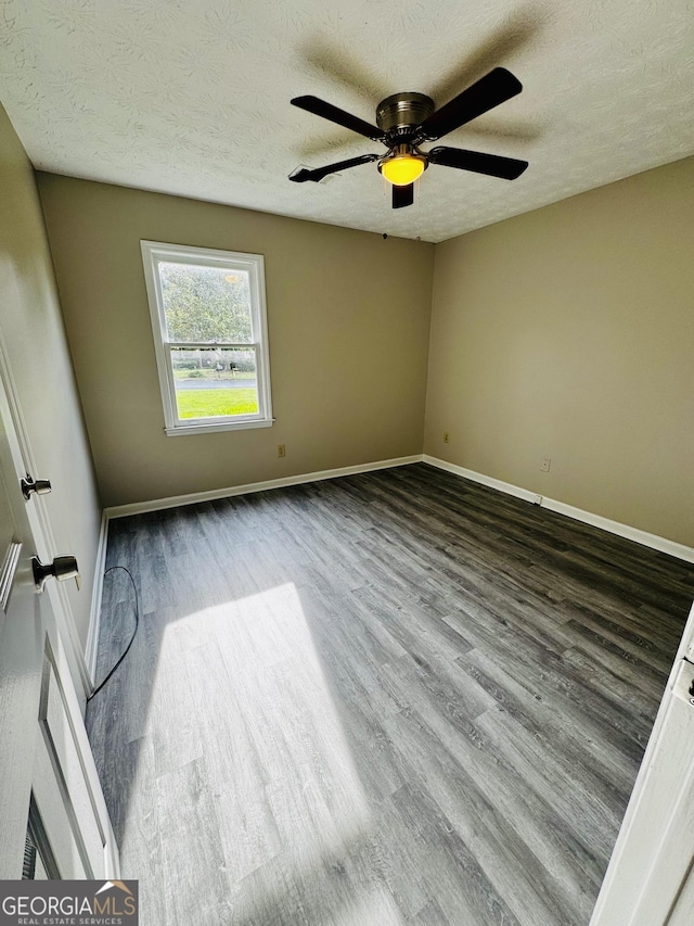 2204 Liberty Ln SW, Conyers, GA 30094 - unfurnished room with wood finished floors, a textured ceiling, and a ceiling fan