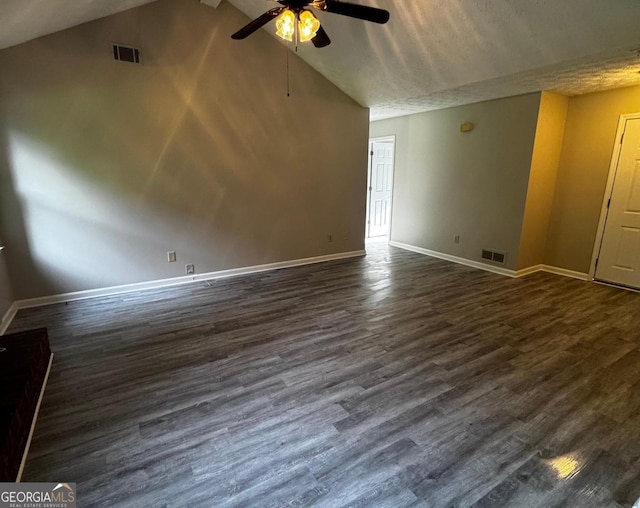2204 Liberty Ln SW, Conyers, GA 30094 - empty room with vaulted ceiling, ceiling fan, and dark wood-type flooring