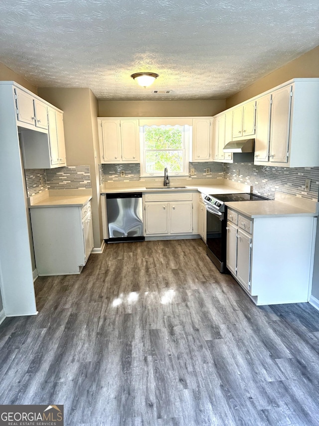 2204 Liberty Ln SW, Conyers, GA 30094 - kitchen featuring stainless steel dishwasher, electric range, under cabinet range hood, dark wood finished floors, and a textured ceiling