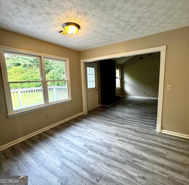 2204 Liberty Ln SW, Conyers, GA 30094 - foyer entrance featuring wood finished floors and a textured ceiling
