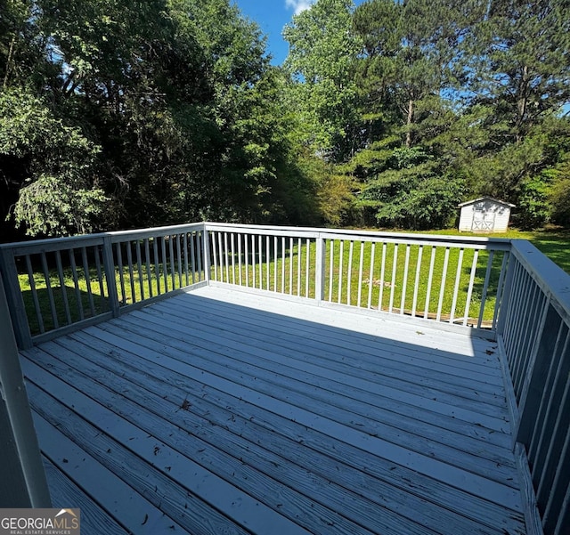 2204 Liberty Ln SW, Conyers, GA 30094 - deck featuring a shed and a lawn