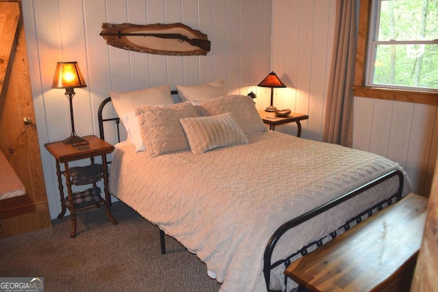 767 Robertson Cir, Blairsville, GA 30512 - bedroom with carpet floors and wooden walls