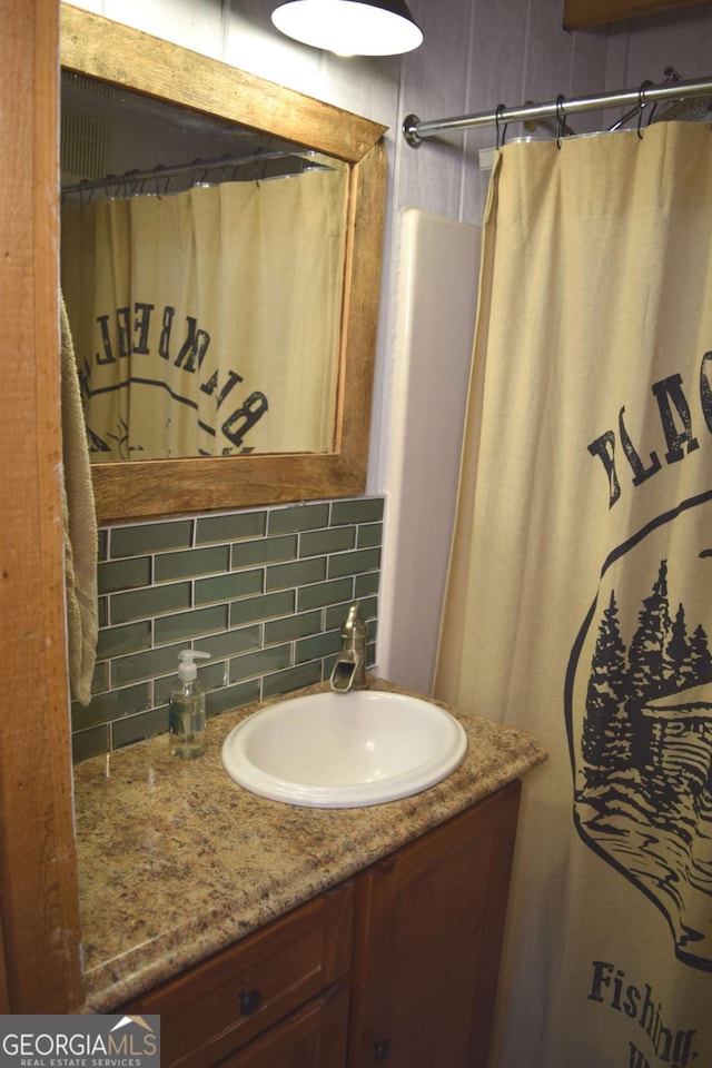 767 Robertson Cir, Blairsville, GA 30512 - bathroom featuring backsplash, vanity, and a shower with shower curtain