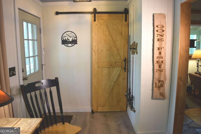767 Robertson Cir, Blairsville, GA 30512 - entrance foyer featuring wood finished floors, a barn door, and baseboards