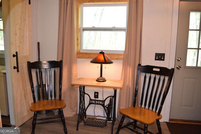 767 Robertson Cir, Blairsville, GA 30512 - sitting room with healthy amount of natural light and wood finished floors