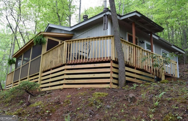 767 Robertson Cir, Blairsville, GA 30512 - rear view of house with stairway, a sunroom, and a deck