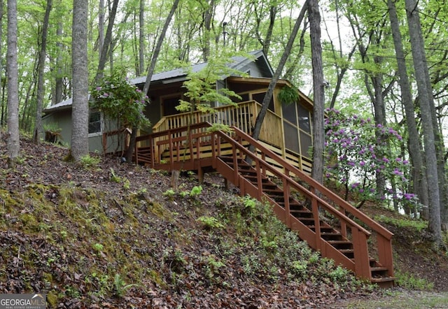 767 Robertson Cir, Blairsville, GA 30512 - back of property with stairway, a sunroom, and metal roof