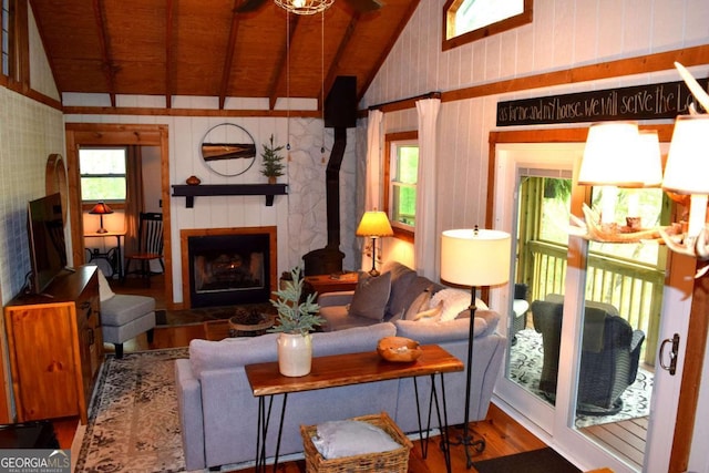 767 Robertson Cir, Blairsville, GA 30512 - living area with lofted ceiling, wood finished floors, wooden ceiling, a fireplace, and wallpapered walls