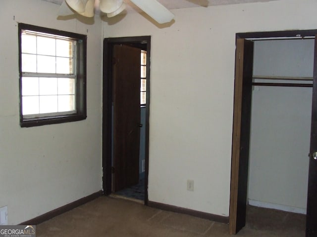 7225 Pineneedle Dr SW, Covington, GA 30014 - unfurnished bedroom with baseboards, carpet flooring, and a closet