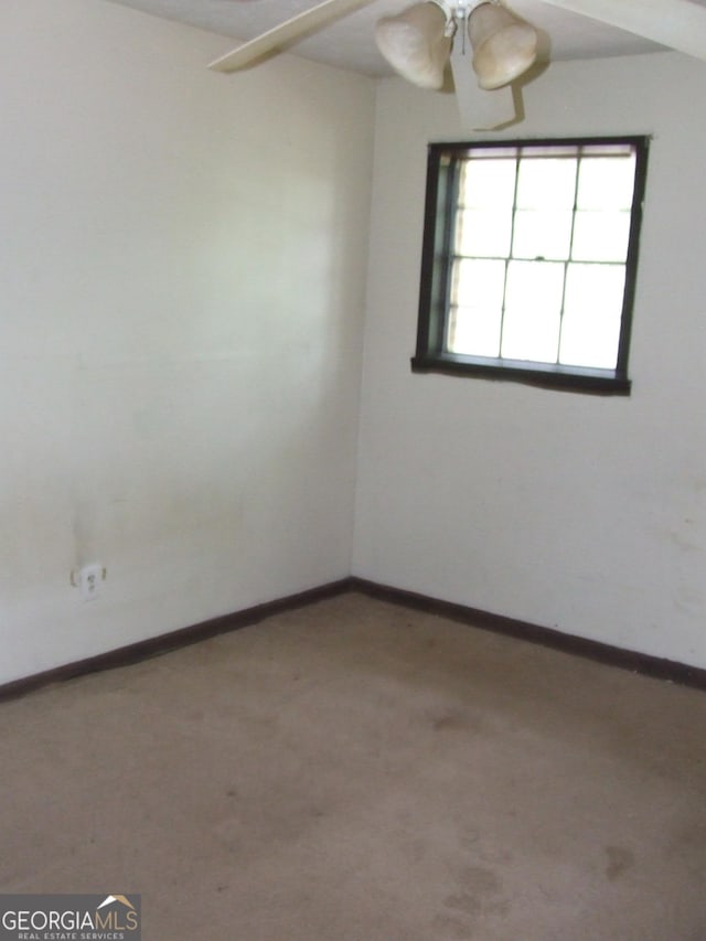 7225 Pineneedle Dr SW, Covington, GA 30014 - spare room featuring ceiling fan, carpet flooring, and baseboards
