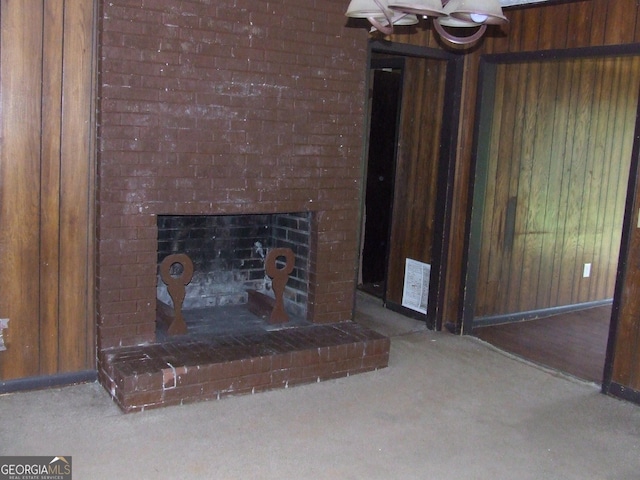 7225 Pineneedle Dr SW, Covington, GA 30014 - detailed view of carpet flooring, wooden walls, a fireplace, and baseboards