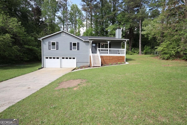 view of front of home featuring driveway, a chimney, a front yard, and a garage