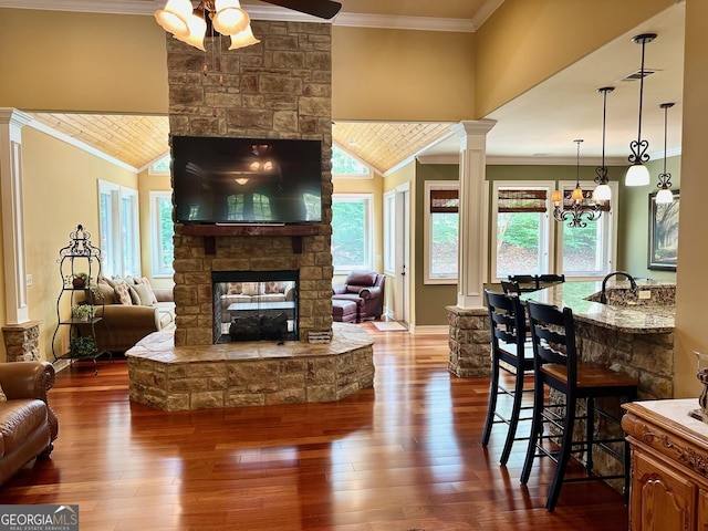 3397 Holly Glen Dr, Dacula, GA 30019 - living area with plenty of natural light, ornamental molding, a ceiling fan, and a stone fireplace
