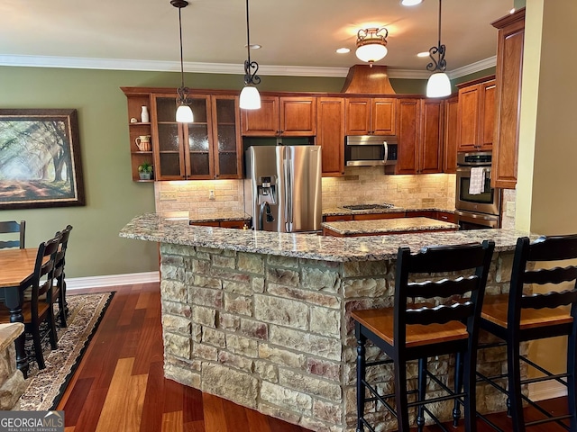 3397 Holly Glen Dr, Dacula, GA 30019 - kitchen featuring light stone countertops, appliances with stainless steel finishes, and a kitchen bar