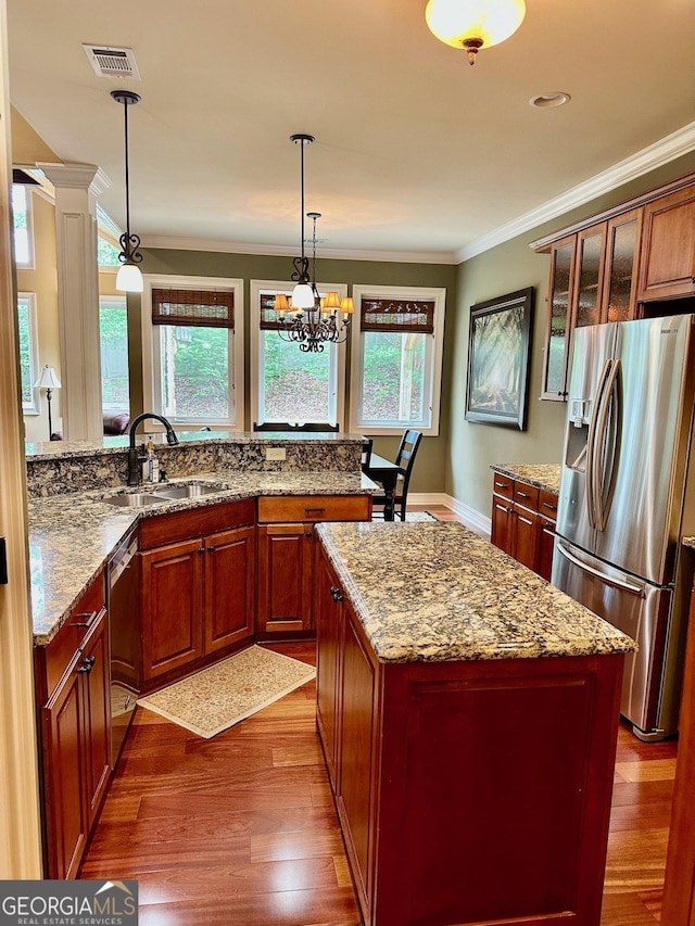 3397 Holly Glen Dr, Dacula, GA 30019 - kitchen with a sink, crown molding, stainless steel appliances, and dark wood finished floors
