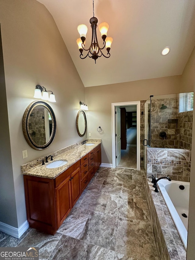 3397 Holly Glen Dr, Dacula, GA 30019 - bathroom with a sink, double vanity, baseboards, lofted ceiling, and a garden tub