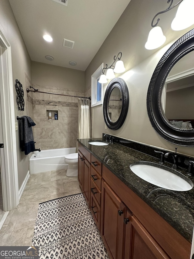 3397 Holly Glen Dr, Dacula, GA 30019 - bathroom with a sink, shower / bath combination with curtain, toilet, and visible vents