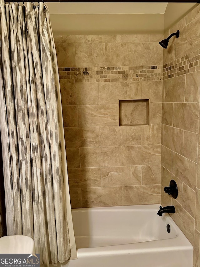 3397 Holly Glen Dr, Dacula, GA 30019 - bathroom with toilet and shower / tub combo with curtain