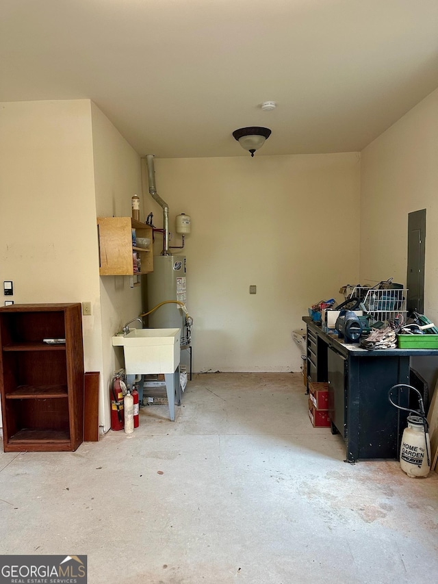 3397 Holly Glen Dr, Dacula, GA 30019 - garage with a sink, electric panel, and gas water heater