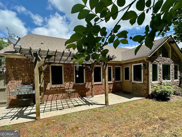 3397 Holly Glen Dr, Dacula, GA 30019 - back of house with brick siding, a shingled roof, a patio area, and a pergola