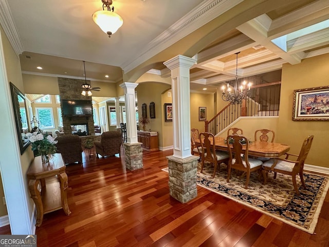 3397 Holly Glen Dr, Dacula, GA 30019 - dining room with ornamental molding, decorative columns, wood finished floors, beam ceiling, and arched walkways