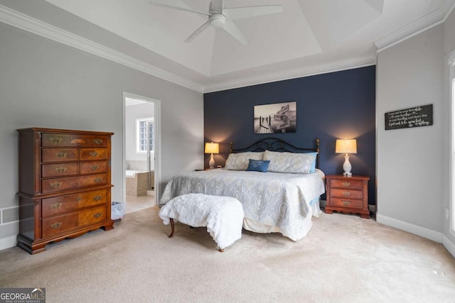 bedroom with carpet flooring, crown molding, and a tray ceiling
