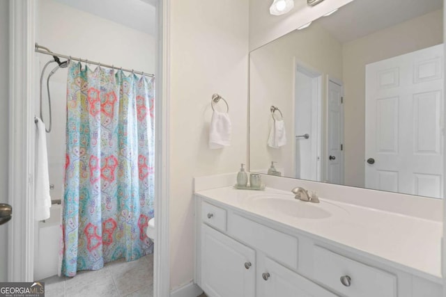 bathroom with vanity, tile patterned flooring, toilet, and shower / bathtub combination with curtain