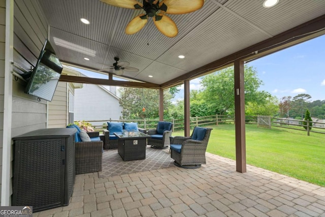 view of patio featuring a fenced backyard, ceiling fan, and outdoor lounge area