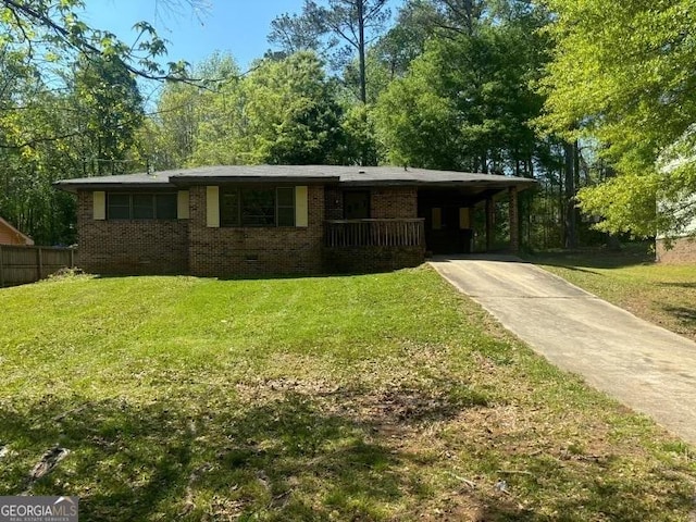 single story home with brick siding, concrete driveway, a carport, and crawl space