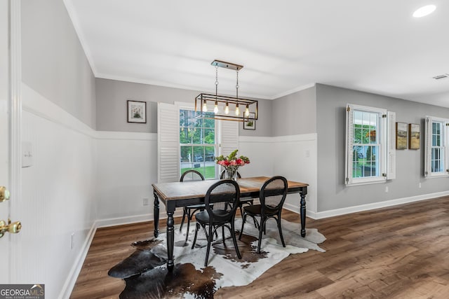 620 Clearbrook Ct, Marietta, GA 30068 - dining space with wood finished floors, crown molding, and a chandelier
