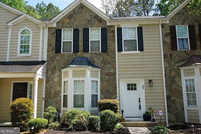 view of front of property featuring stone siding