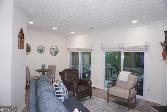 2566 Summit Cove Dr, Duluth, GA 30097 - living room with wood finished floors, ornamental molding, recessed lighting, and baseboards