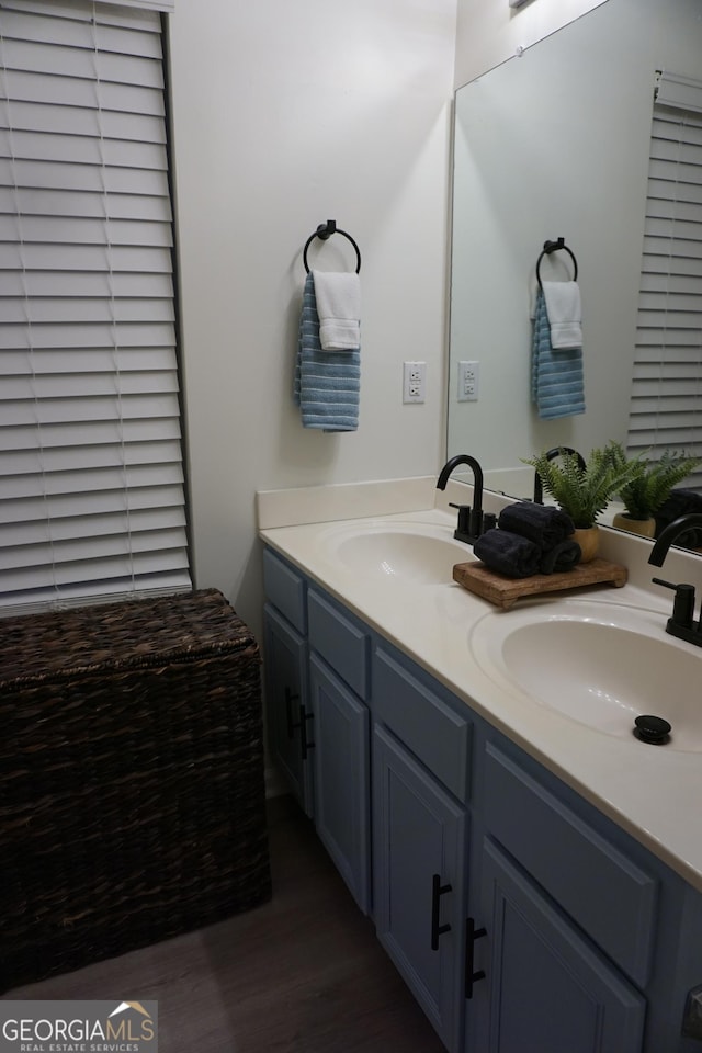 2566 Summit Cove Dr, Duluth, GA 30097 - full bathroom with double vanity and wood finished floors