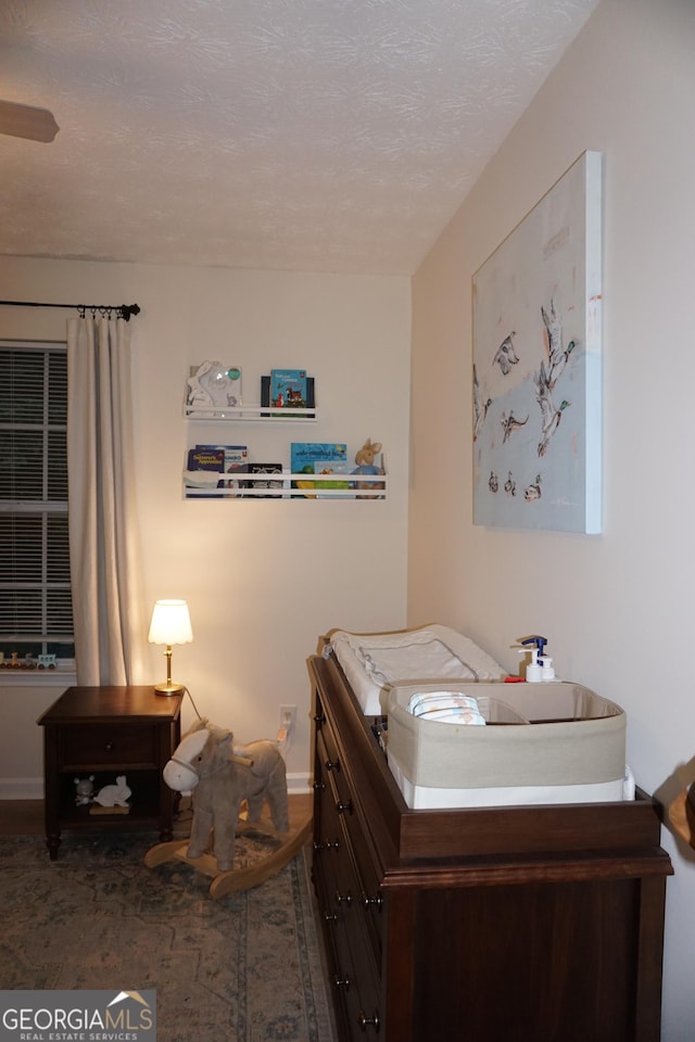 2566 Summit Cove Dr, Duluth, GA 30097 - bedroom featuring a textured ceiling and baseboards