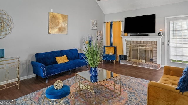 1401 Aberdeen Ct, Mcdonough, GA 30253 - living room featuring baseboards, a fireplace, vaulted ceiling, and wood finished floors