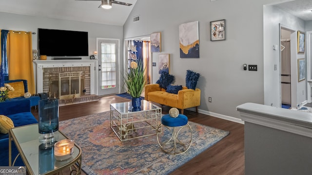 1401 Aberdeen Ct, Mcdonough, GA 30253 - living area with a brick fireplace, a ceiling fan, baseboards, wood finished floors, and vaulted ceiling