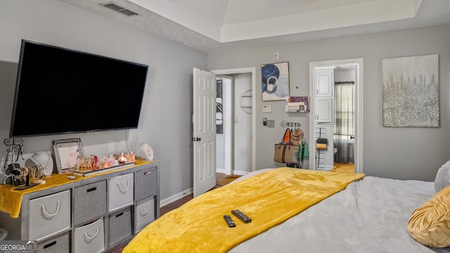 1401 Aberdeen Ct, Mcdonough, GA 30253 - bedroom with baseboards, visible vents, and a raised ceiling