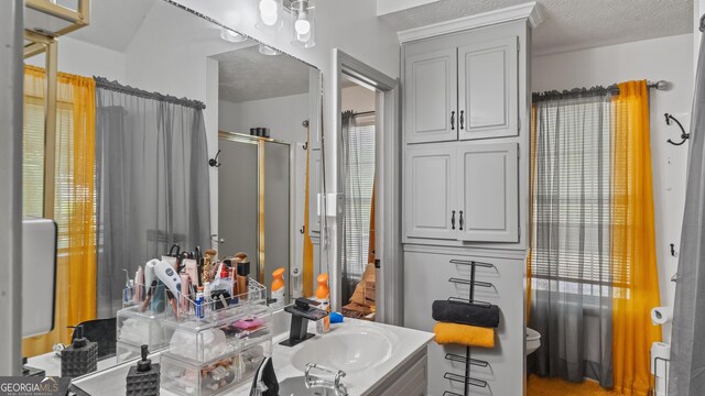 1401 Aberdeen Ct, Mcdonough, GA 30253 - full bathroom with vanity, a stall shower, and a textured ceiling