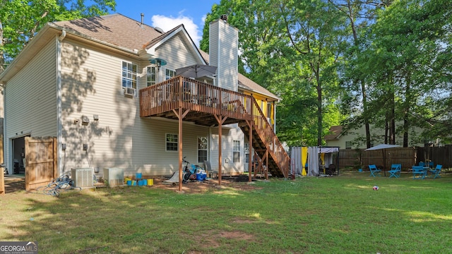 1401 Aberdeen Ct, Mcdonough, GA 30253 - rear view of house featuring central AC, a wooden deck, fence, a yard, and stairway