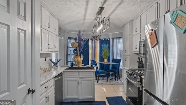 1401 Aberdeen Ct, Mcdonough, GA 30253 - kitchen with light tile patterned floors, a textured ceiling, appliances with stainless steel finishes, and a sink